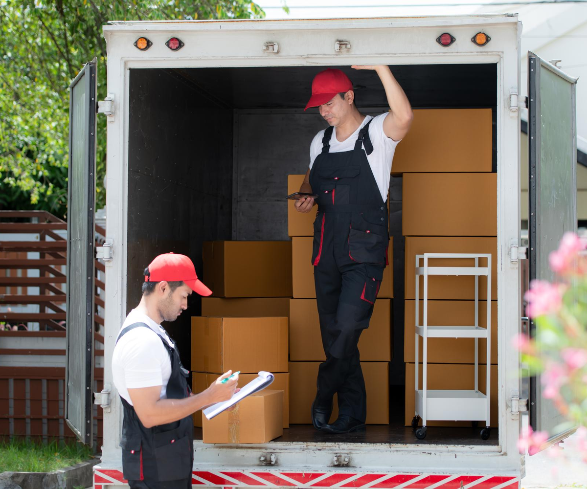 Movers checking inventory inside truck for long-distance move – Moving Pro Dallas