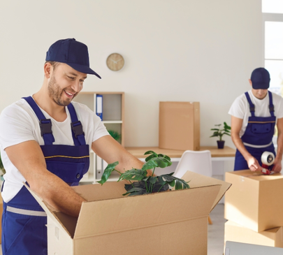 Professional movers carefully packing household items into boxes – Moving Pro Dallas