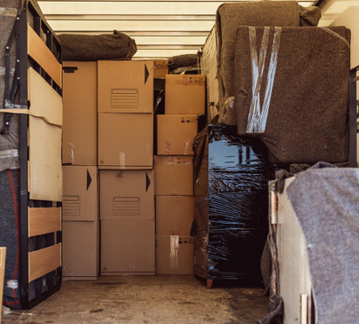 Secure moving truck interior with wrapped furniture and boxes – Moving Pro Dallas